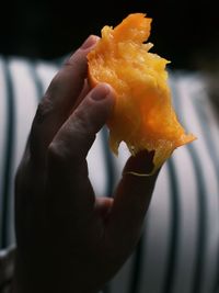 Close-up of hand holding ice cream