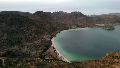 High angle view of beach surrounded by mountains