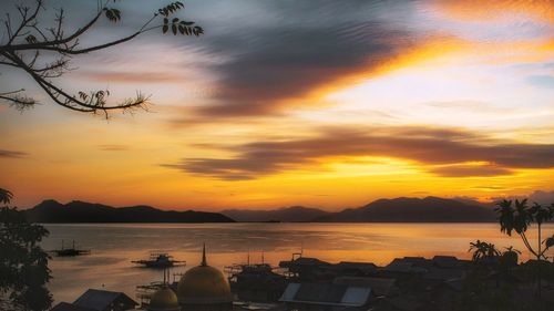 Scenic view of sea against orange sky