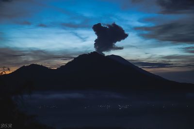 Scenic view of silhouette mountain against sky
