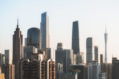 Skyscrapers in city against clear sky