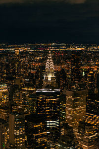 Illuminated buildings in city at night