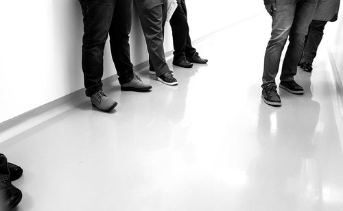 Low section of people standing on floor