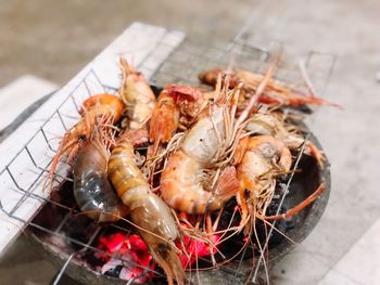 High angle view of shrimps on barbecue