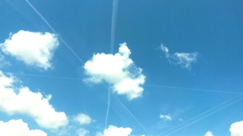 Low angle view of vapor trails in sky