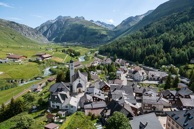 The village hospental in the swiss alps, switzerland, andermatt in the background