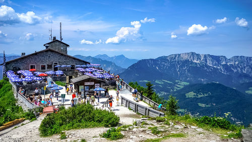 Traditional building by mountains against sky