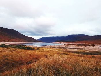 Scenic view of cloudy sky over mountains
