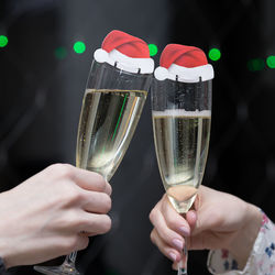 Cropped hand holding wine glass