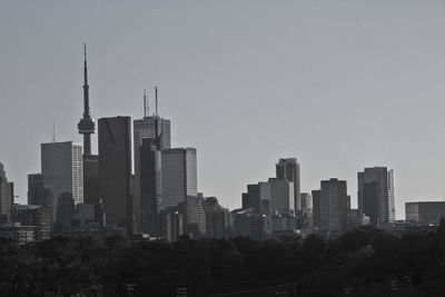 Skyscrapers in city against clear sky