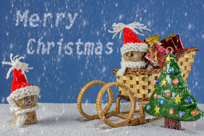 Close-up of christmas decorations on snow