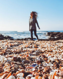 Full length of woman standing on beach