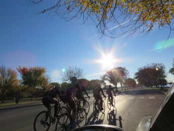 People riding motorcycle on road