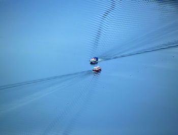 Low angle view of cables against blue sky