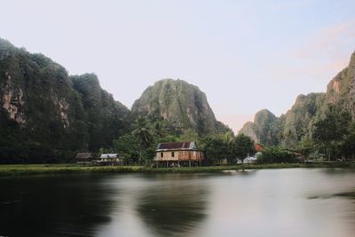 Scenic view of lake and mountains against clear sky