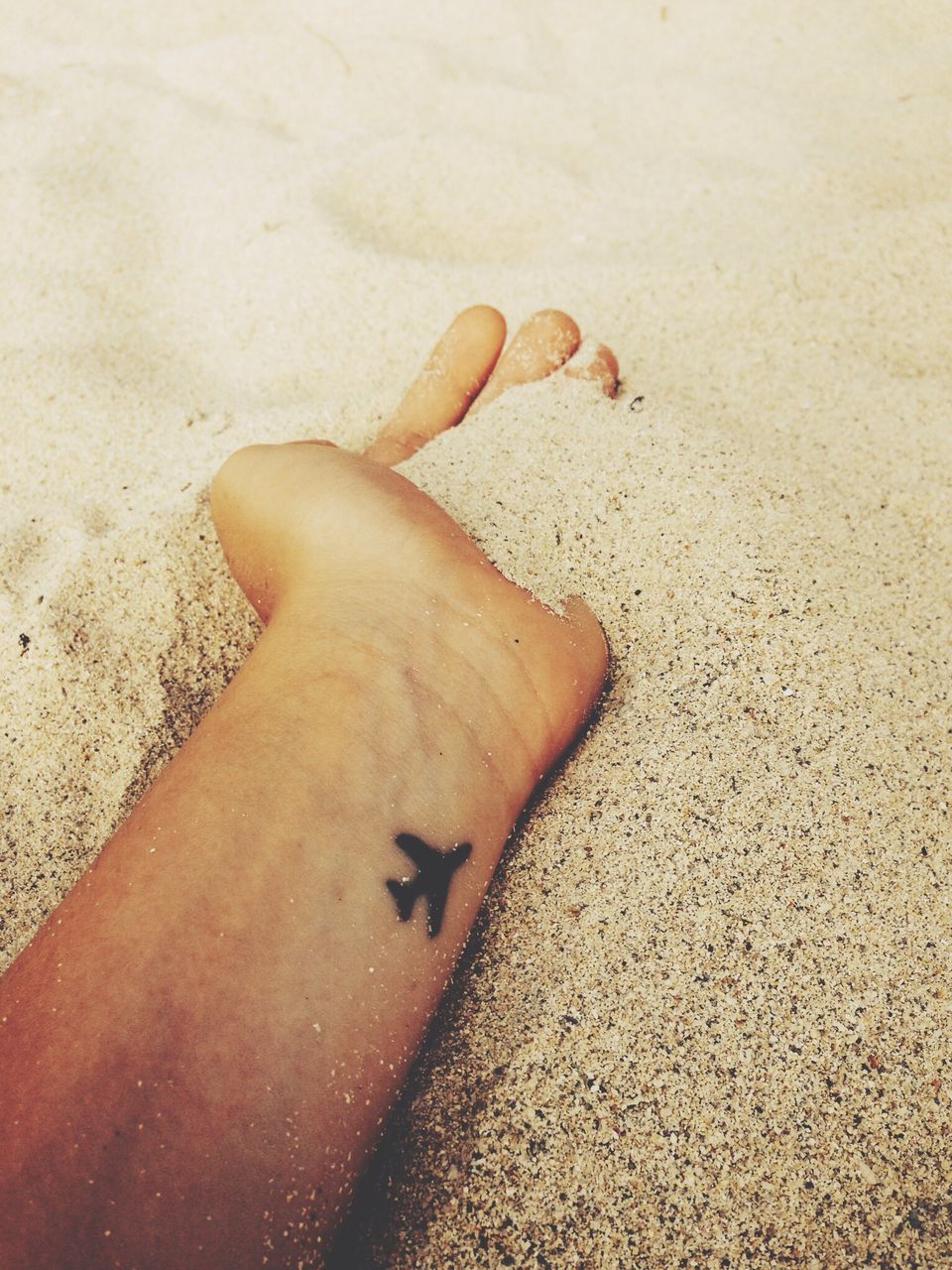 sand, high angle view, beach, person, personal perspective, low section, part of, unrecognizable person, lifestyles, shadow, leisure activity, sunlight, human foot, barefoot, human finger, cropped