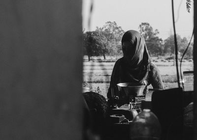 A girl in heated environment buying grocieries wearing hijab 