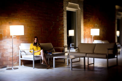 Woman sitting on chair at table