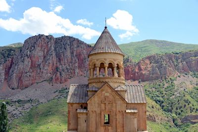 View of a building with mountain range in background