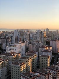 High angle view of buildings against sky during sunset