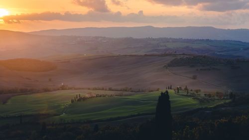 Scenic view of landscape against sky during sunset