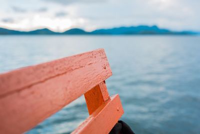 Close-up of wood against sea