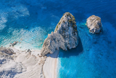 High angle view of rocks in sea