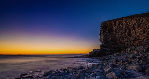 View of beach against sky during sunset