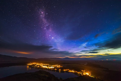 Scenic view of mountains against sky at night