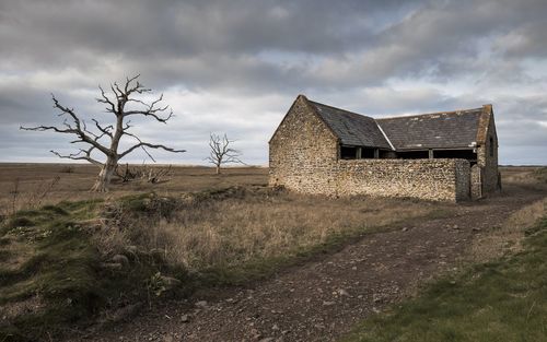House on field against sky