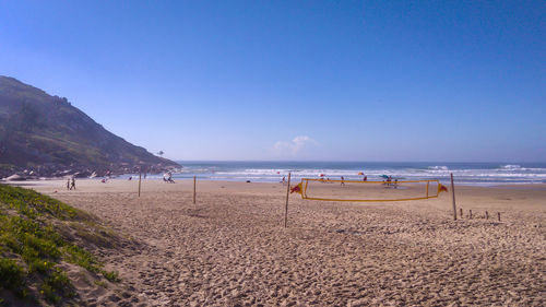 Scenic view of beach against clear sky