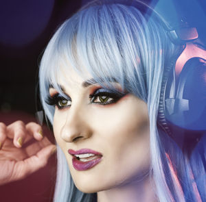 Close-up of mid adult woman wearing headphones