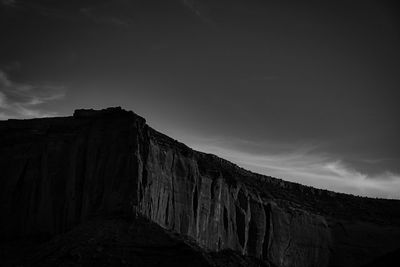 Low angle view of rock formation against sky