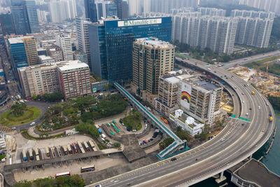 High angle view of traffic on road amidst buildings in city