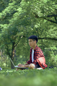 Man sitting with umbrella