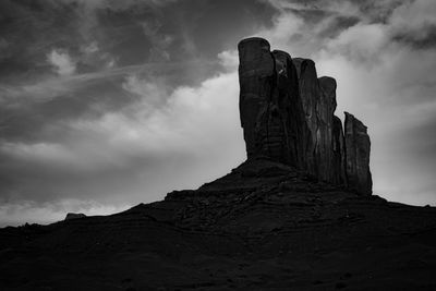 Low angle view of rock formation against sky