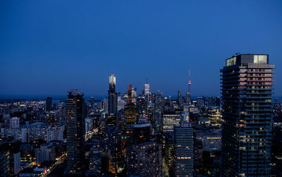 High angle view of cityscape against clear blue sky