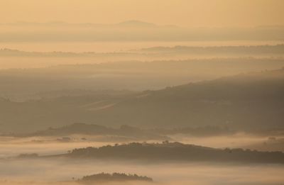 Scenic view of mountains against dramatic sky