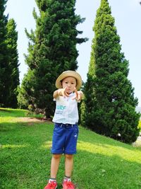 Full length of boy standing on field