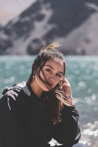 Portrait of young woman in water