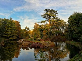 Reflection of trees in lake against sky during autumn