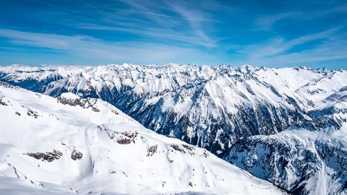 Scenic view of snowcapped mountains against sky