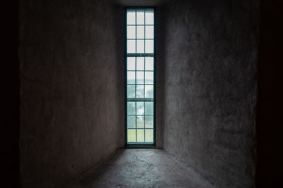 Low angle view of window in abandoned building