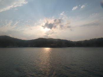 Scenic view of lake against sky during sunset