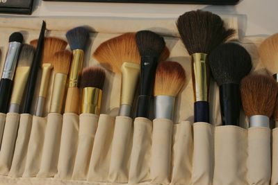 Close-up of make-up brush in case on table