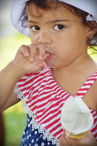 Portrait of cute girl eating ice cream