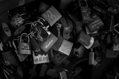 Close-up of padlocks hanging on railing