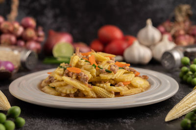 Close-up of pasta served in plate on table