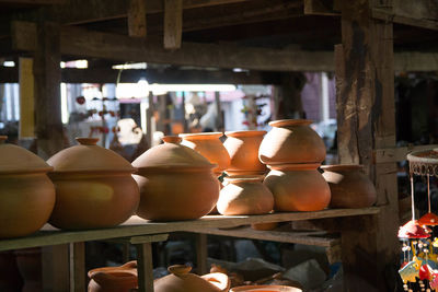 Various clay pots for sale at market stall