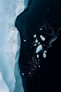 Close-up of woman standing in frozen sea